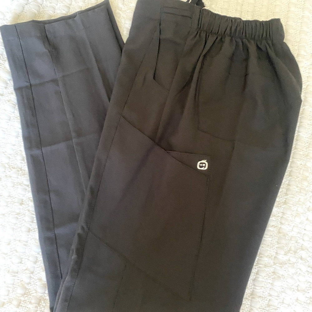 Very cute and flattering Black Scrub slacks with multiple pockets.